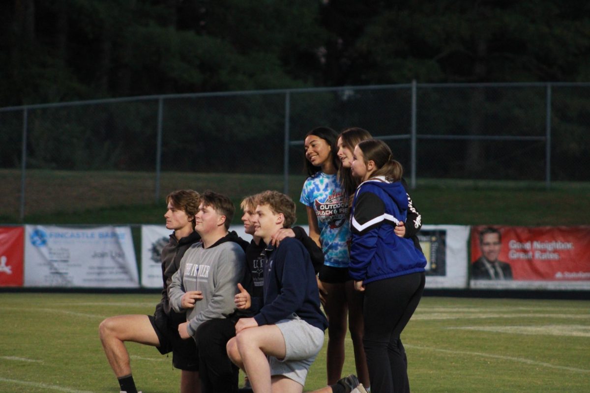 Cheerleaders pose for a picture.