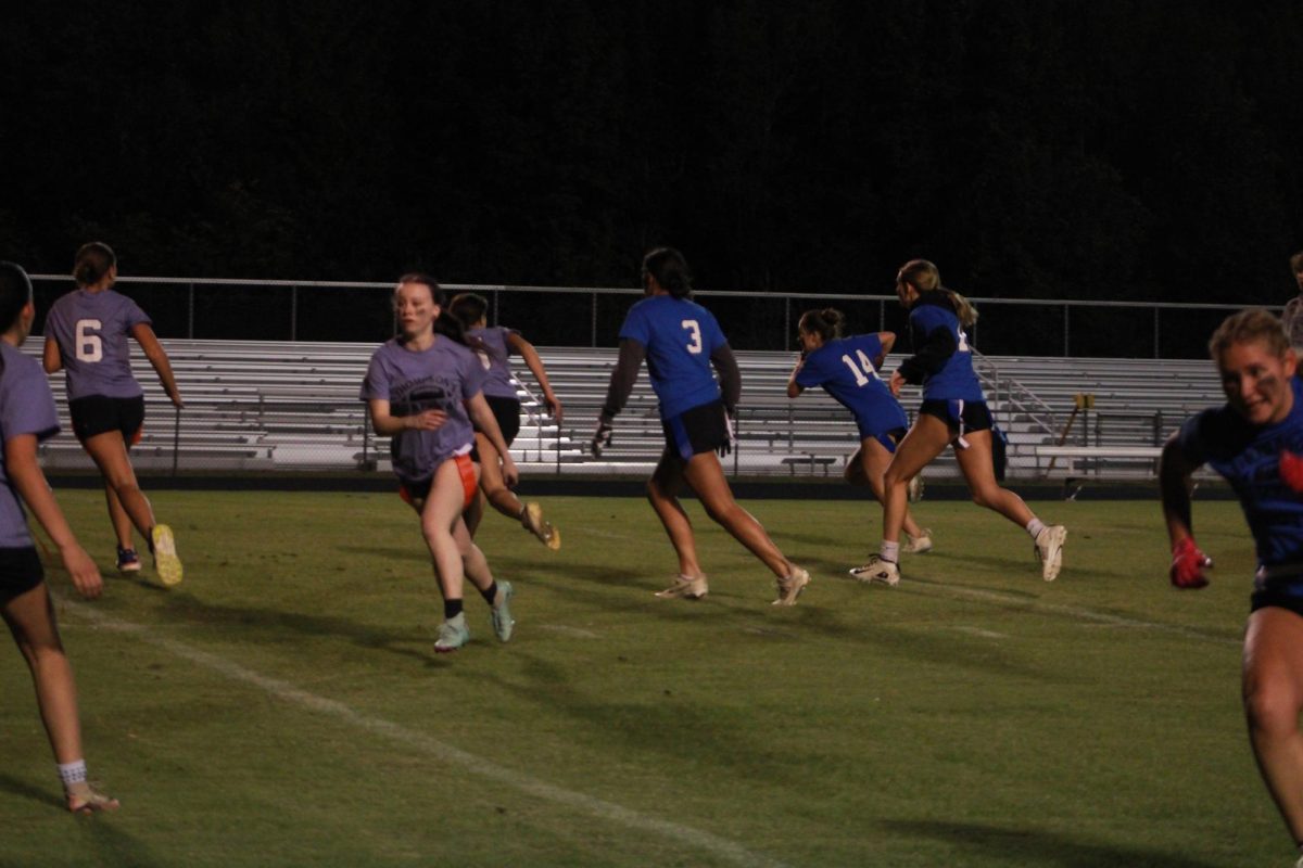 Player's run down the field.