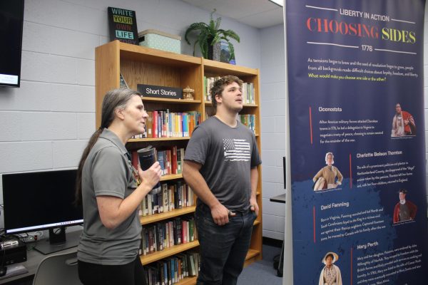 Senior Jack Wonderly and Michelle Steiner discuss a display.