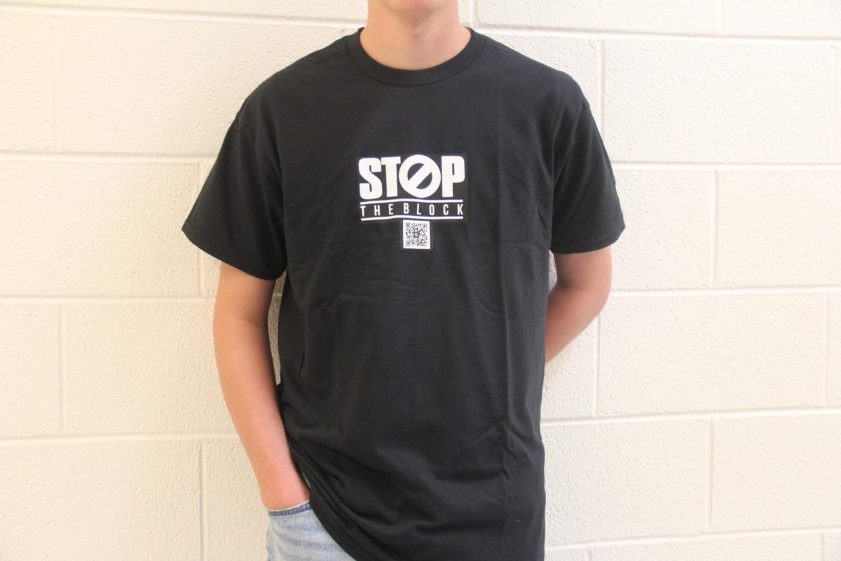 A student wearing a "Stop the Block" T-shirt.