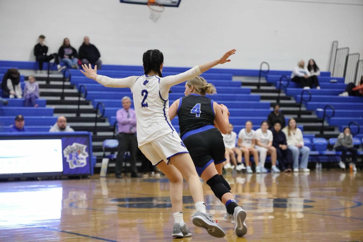 Senior Bella Dorey guards player