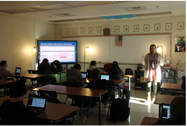 Counselors work on scheduling students