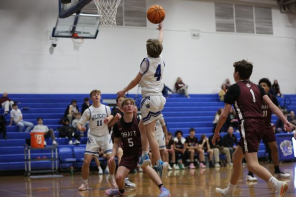 Rowe Carter drives baseline.