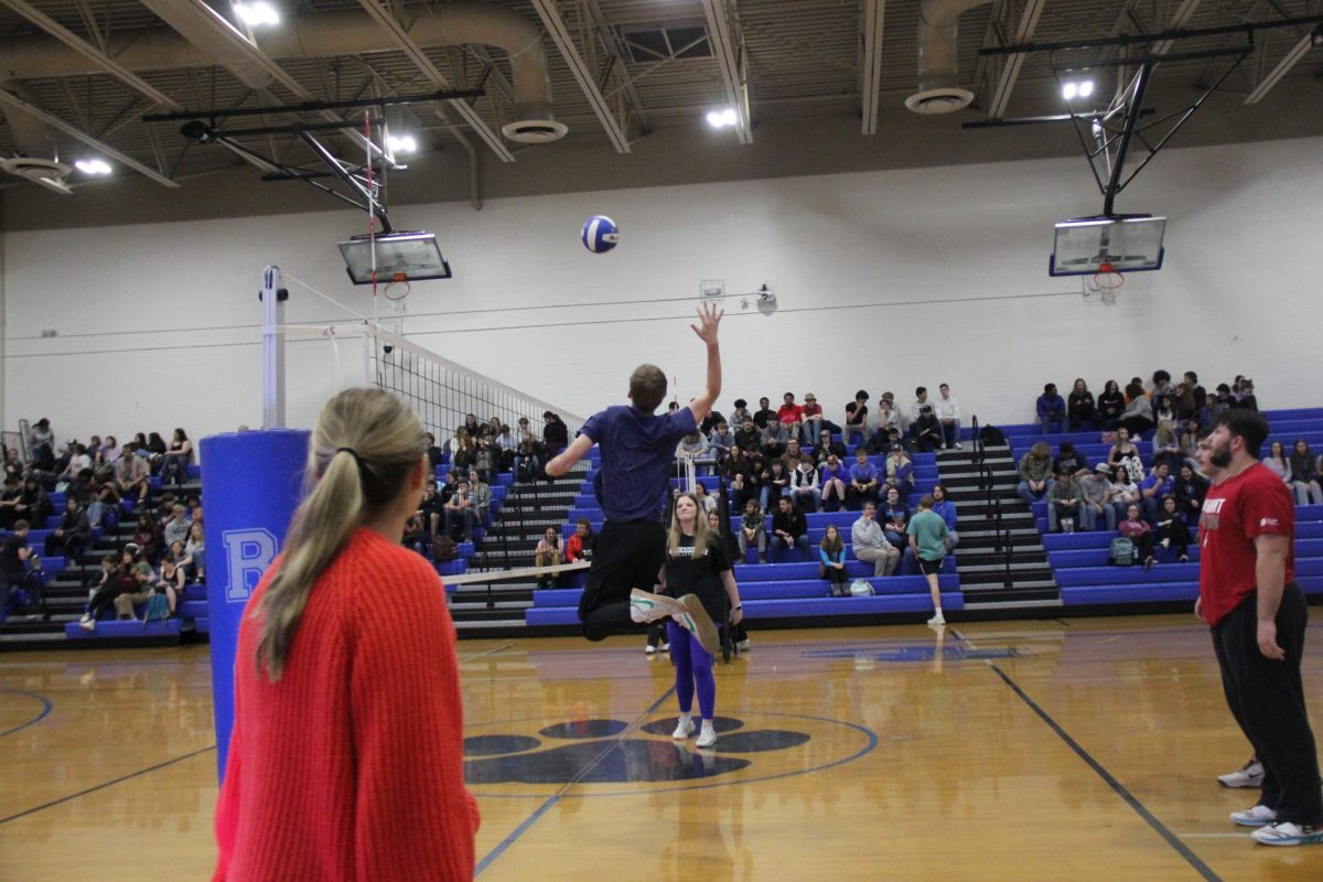 Senior Jackson Johnson spikes the ball.