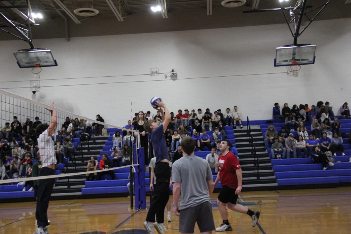 Senior Jackson Johnson sets the ball.