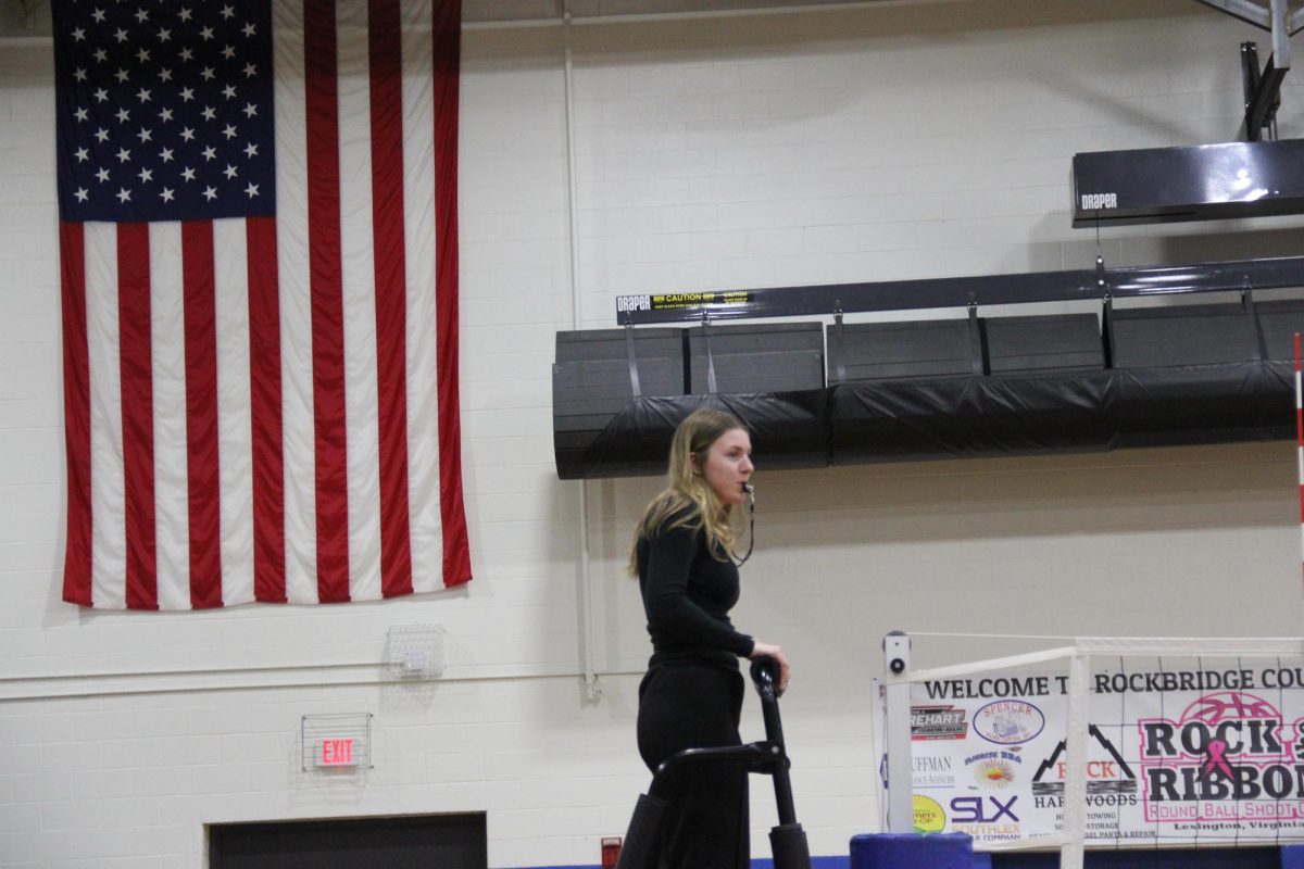 Junior Emmy Duff refs the game.