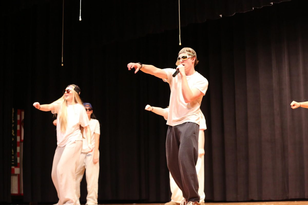 Senior Fisher Howald lip syncs for the Executive Council act