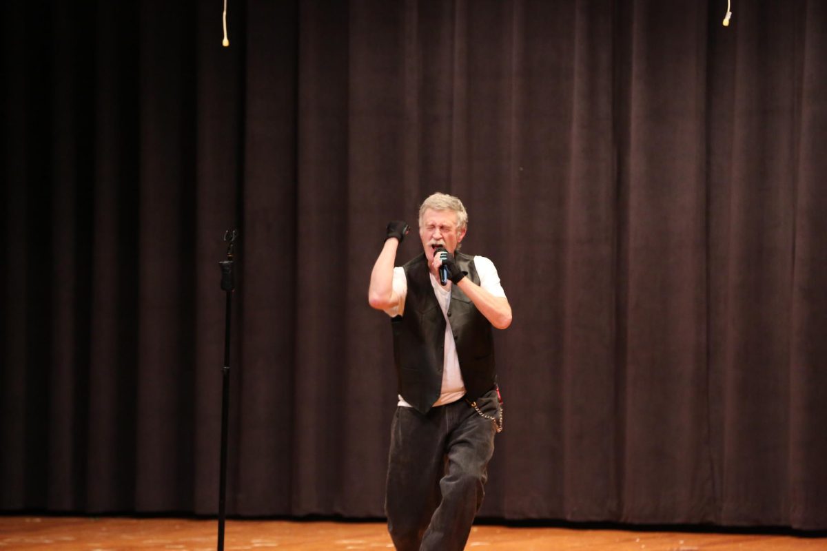 Technology Specialist, and peoples choice award winner, Mr. Patterson performs "No More Mr. Nice Guy"