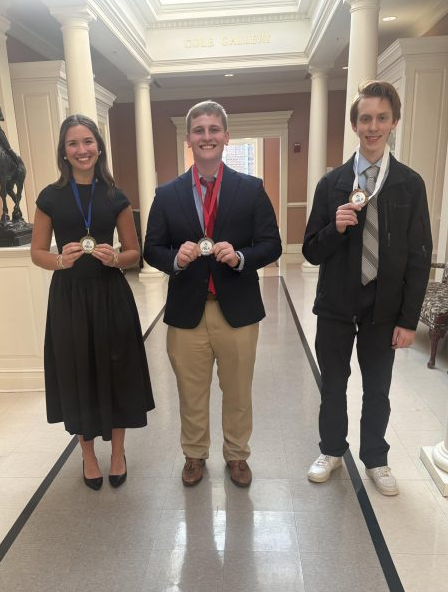 Junior historian Cate Wilson, junio president Eli Watkins, and sophomore treasurer Evan Wilson pose with their medals. Photo courtesy Graceon Whitesell.