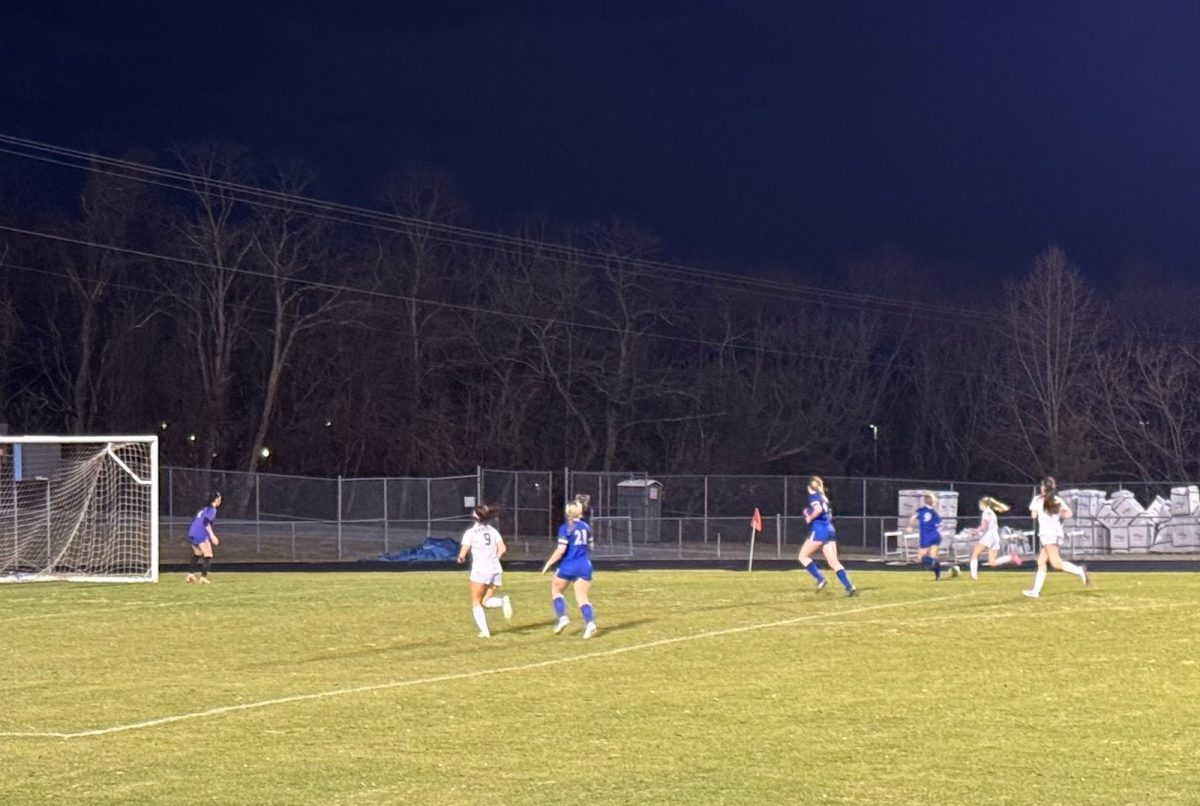  Girls soccer team plays defense against Amherst.