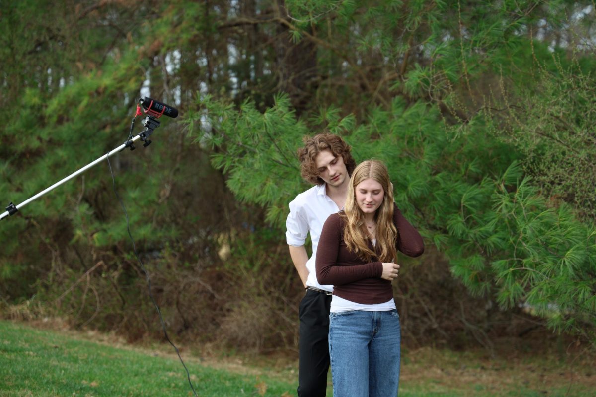Seniors Summer Hull and River Jenkins act out a scene as Bella and Edward, respectively. 