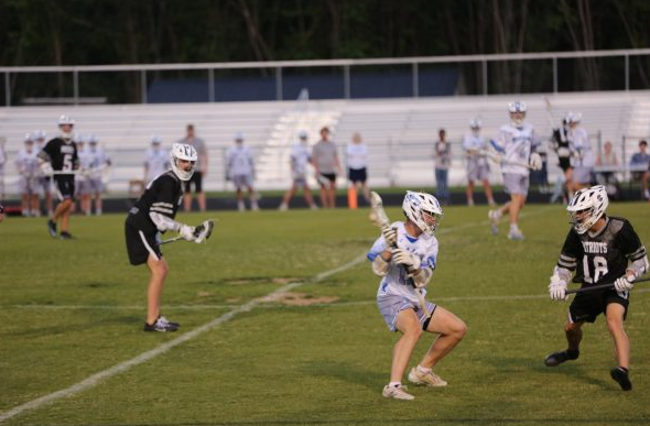 Sophomore Parker  Flint dodges defender 