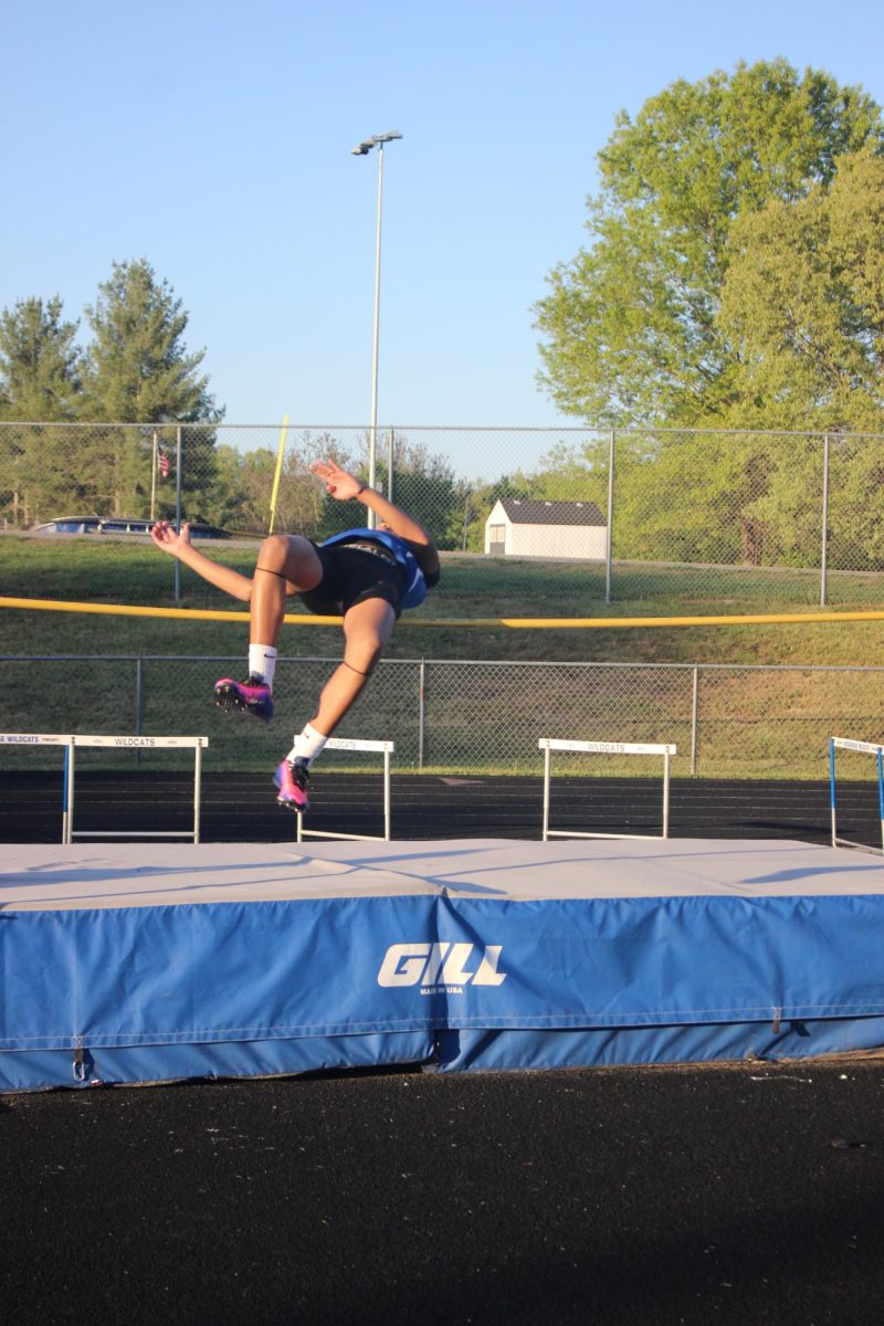 Tyshon Wilson jumping over the bar.